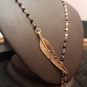 NQT:INC Y necklace with beads and leaf